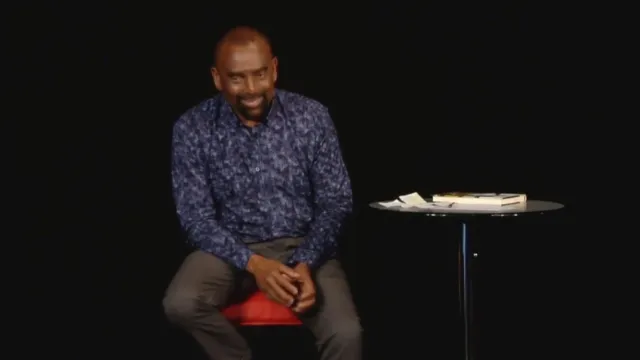 Jesse laughs while talking with the Church congregation