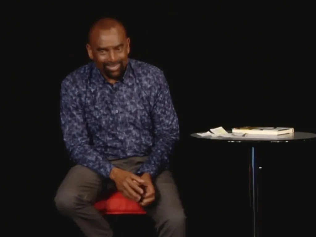 Jesse laughs while talking with the Church congregation