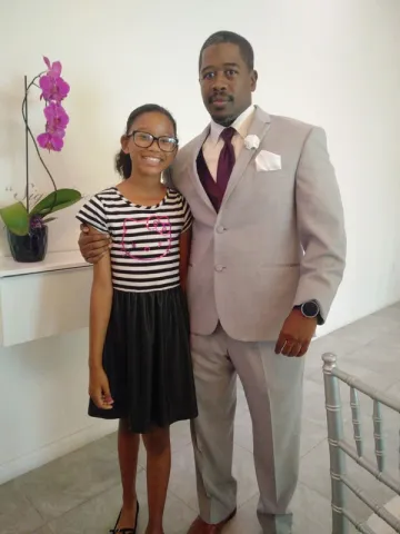 Father and daughter, Derrick and Zara, pose for picture